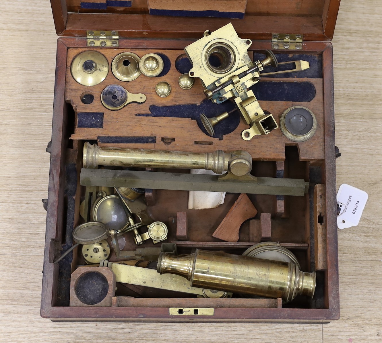 A 19th century cased brass monocular microscope